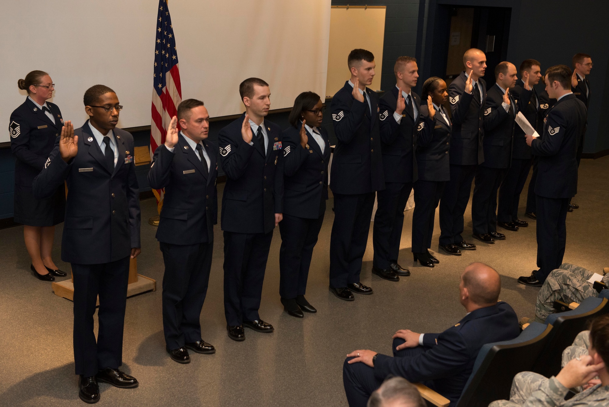Newly promoted Staff Sergeants are sworn in during a promotion recognition ceremony at Minneapolis-St. Paul Air Reserve Station, Minn., May. 5, 2018. The commemoration recognized Airmen who have been promoted to a new tier of the enlisted ranks, signifying a level of accomplishment each inductee has achieved in their Air Force career. (U.S. Air Force Photo by Tech. Sgt. Amber E. N. Jacobs)