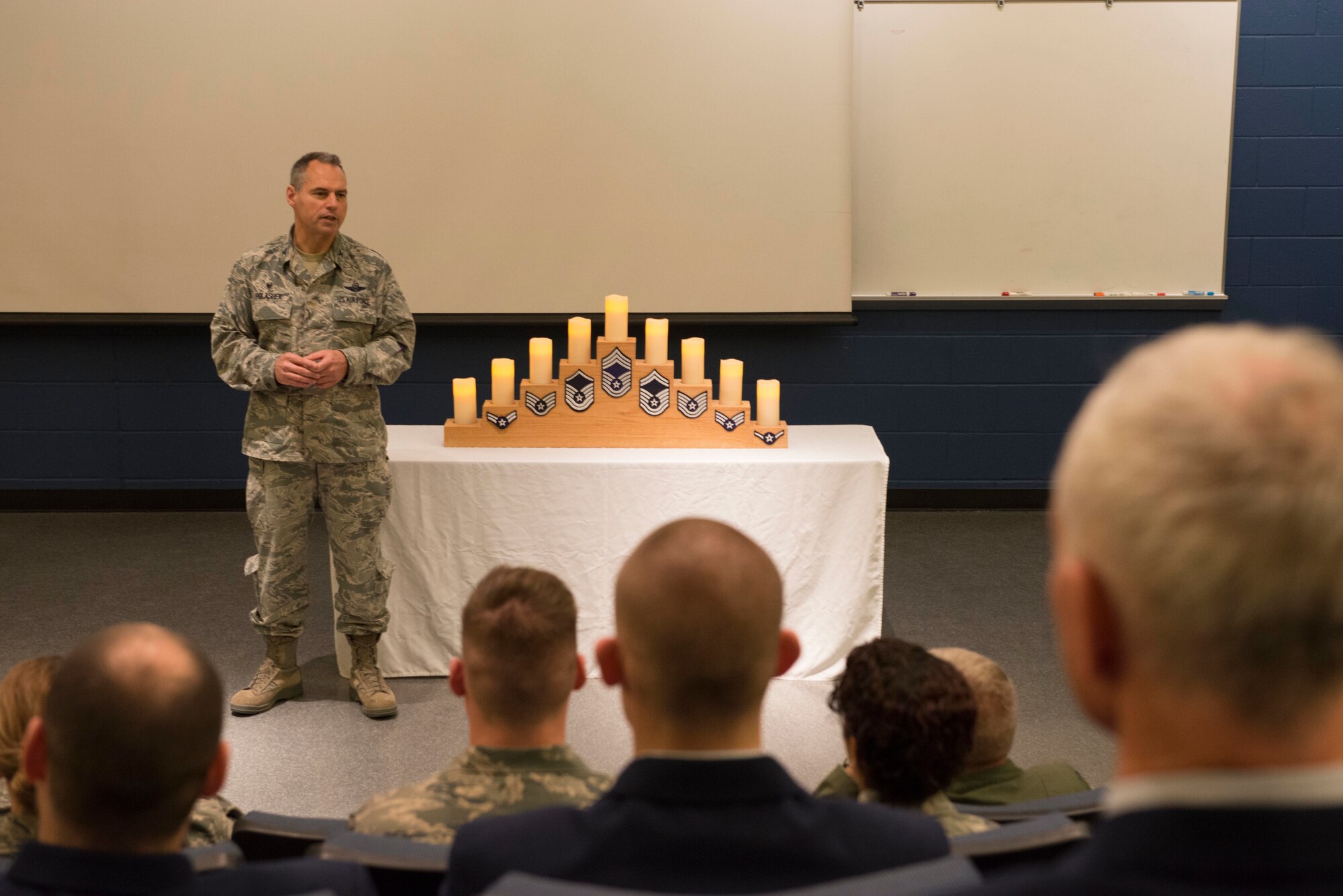 Col. Tony Polashek, 934th Airlift Wing commander, talks with newly promoted Master Sergeants and Staff Sergeants during a promotion recognition ceremony at Minneapolis-St. Paul Air Reserve Station, Minn., May. 5, 2018. The 934th AW recognized their newest senior non-commissioned officers and NCOs as part of a time honored tradition. (U.S. Air Force Photo by Tech. Sgt. Amber E. N. Jacobs)