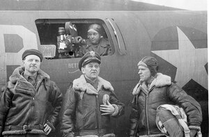 Maj William Wyler (center) with two of his cameramen—William Clothier (right) and William 
Skall (in window)—and British war correspondent Cavo Chin (left).