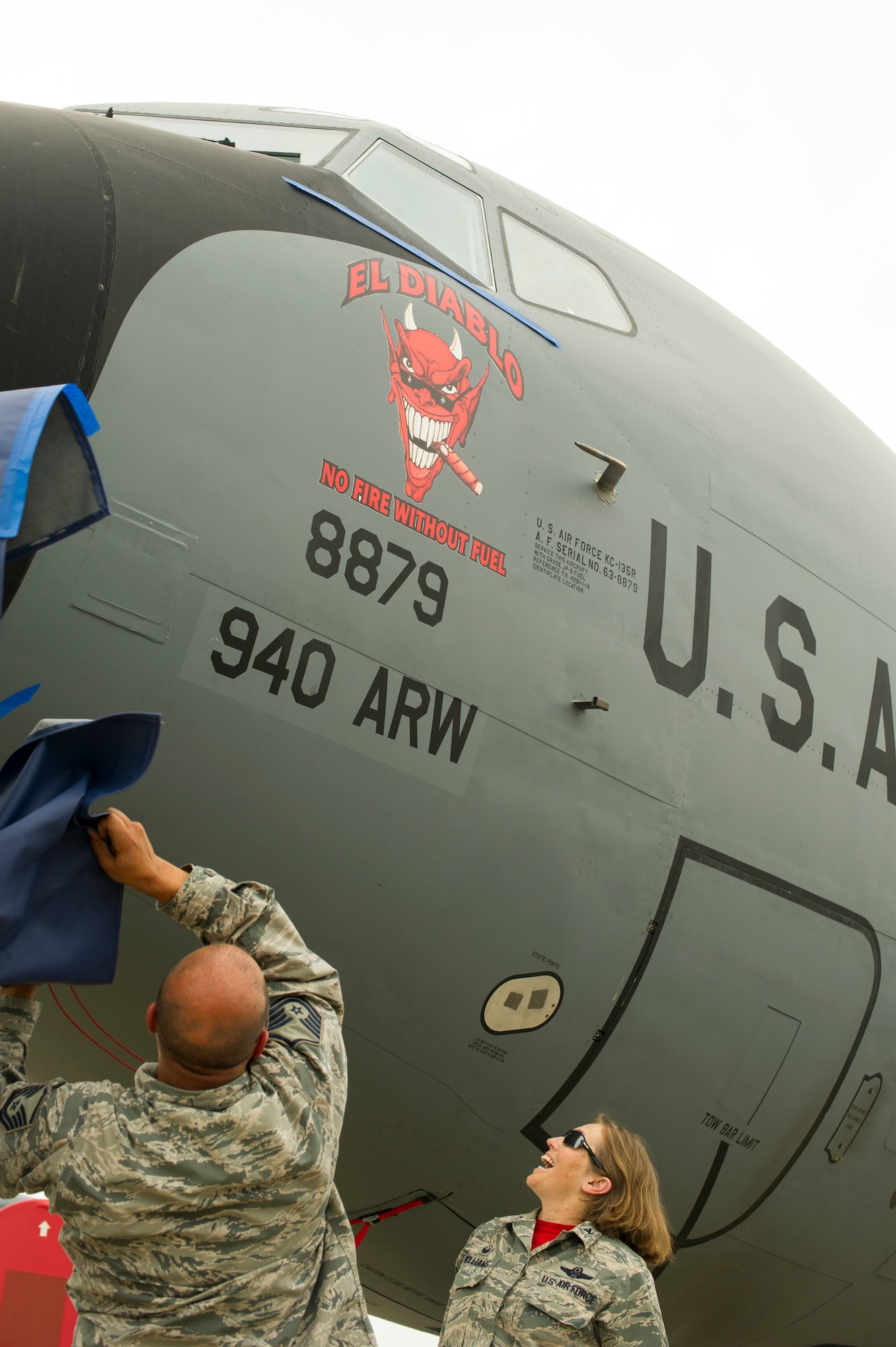 Master Sgt. Joe Simpson, 940th Aircraft Maintenance Squadron dedicated crew chief, and Col. Stephanie W. Williams, 940th Air Refueling Wing commander, uncover the “El Diablo” nose art on a KC-135 Stratotanker May 5 at Beale Air Force Base, California.