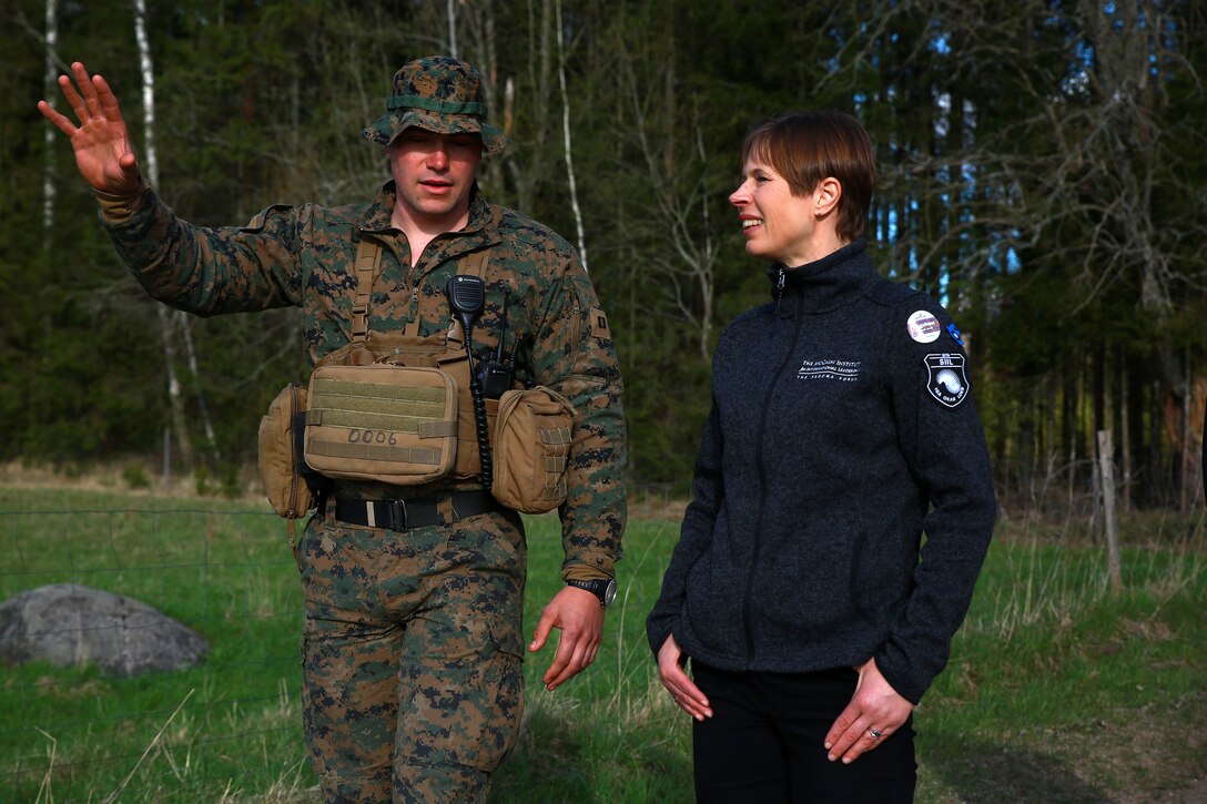 The President of Estonia Kersti Kaljulaid discusses Exercise Hedgehog with Marine Rotational Force-Europe (MRFE) 18.1 Bravo Company Commander Capt. Andrew Davis at Voru, Estonia, May 5, 2018. President Kaljulaid visited the Marines and Sailors of MRFE and spoke about the importance of Hedgehog, which is an annual event designed to strengthen strategic cooperation and partnership among participants. This the first time the Marine Corps has participated in the exercise, which also featured several other NATO countries. (U.S. Marine Corps photo by Gunnery Sgt. Clinton Firstbrook)