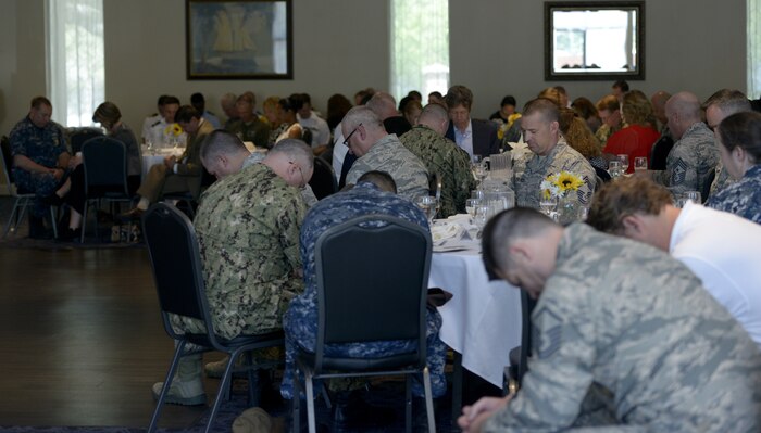 Members from Joint Base Charleston pray during the 2018 National Prayer Luncheon May 3, at the Weapons Station’s Red Bank Club.