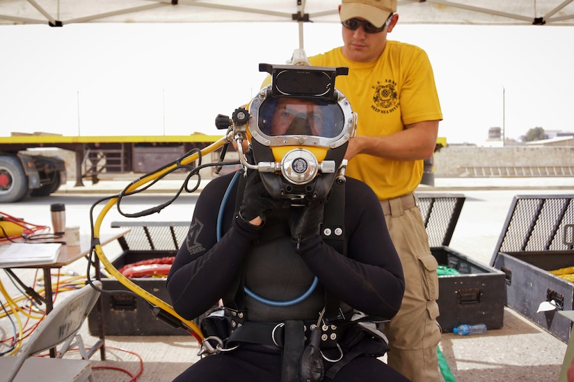 U.S. Army Spc. Jon Nygaard prepares to dive and weld his patch to a project at Kuwait Naval Base, Kuwait on March 9, 2018.