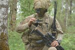 Army 1st. Lt. Michael Austin, a platoon leader for Attack Co., 1st Battalion, 503rd Infantry Regiment, uses an end user device.