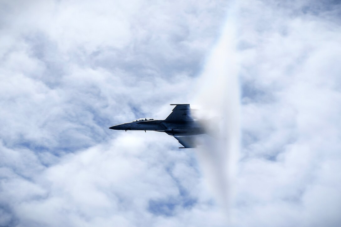An F/A-18F Super Hornet breaks the sound barrier.