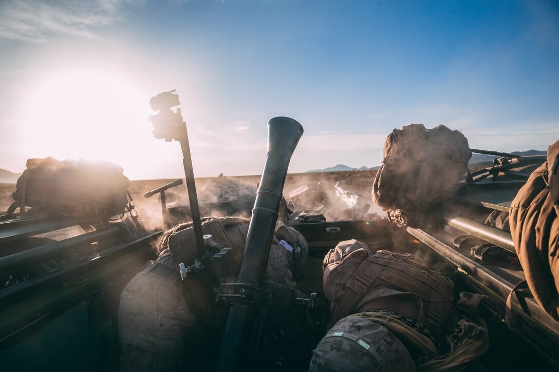 Marines with 2nd Light Armored Reconnaissance Battalion, 2nd Marine Division, fire an 81mm mortar system from a Light Armored Vehicle at Range 630 during Integrated Training Exercise 3-18 aboard the Marine Corps Air Ground Combat Center, Twentynine Palms, Calif., April 30, 2018. The purpose of ITX is to create a challenging, realistic training environment that produces combat-ready forces capable of operating as an integrated Marine Air Ground Task Force. (U.S. Marine Corps photo by Lance Cpl. William Chockey)