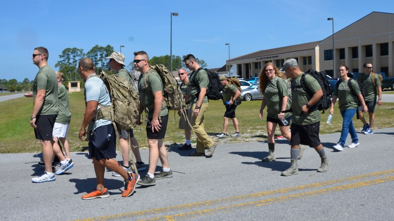 TYNDALL AIR FORCE BASE, Fla.  - 1st Air Force members depart the KIlley Center for Homeland Operations to start the second annual “5K Ruck March for Hunger” May 4 here.
Military and civilian members of 1st Air Force and the 601st Air Operations Center and their family members participated in the event to raise awareness about hunger along with food donations for community food pantries and agencies in the Panama City area.  Nearly 100 people donned 30+ lb. ruck sacks, back packs or donated food to support the food drive which raised 1,911 lbs. The drive began last year when a 1st Air Force Airman saw a statistic stating that numerous students in Bay County were going to school hungry.  (Air Force photo by Mary McHale)