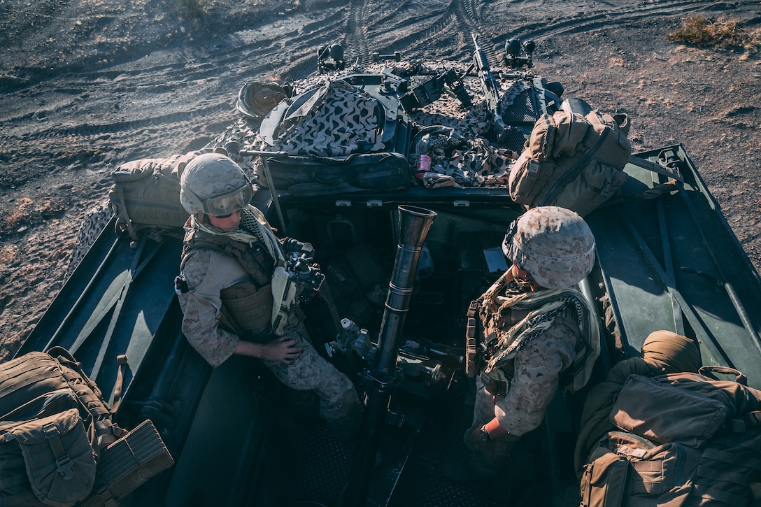 Marines with 2nd Light Armored Reconnaissance Battalion, 2nd Marine Division, stand by for a fire mission in a Light Armored Vehicle at Range 630 during Integrated Training Exercise 3-18 aboard the Marine Corps Air Ground Combat Center, Twentynine Palms, Calif., April 30, 2018. The purpose of ITX is to create a challenging, realistic training environment that produces combat-ready forces capable of operating as an integrated Marine Air Ground Task Force. (U.S. Marine Corps photo by Lance Cpl. William Chockey)