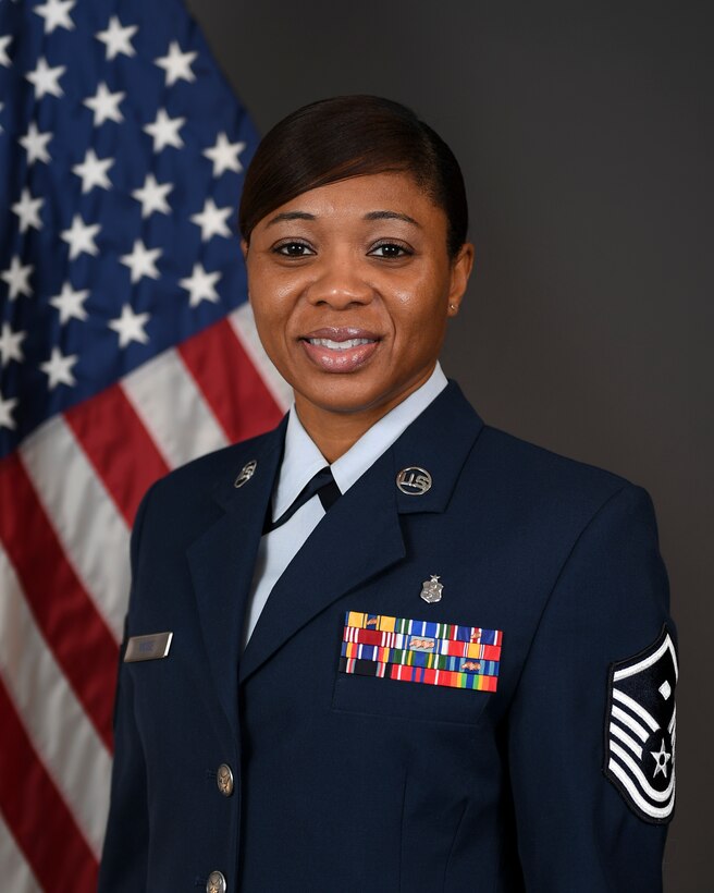 Master Sgt. Tammanica Muse, first sergeant with the 911th Security Forces Squadron, gets her official photo taken at the Pittsburgh International Airport Air Reserve Station, Pa.