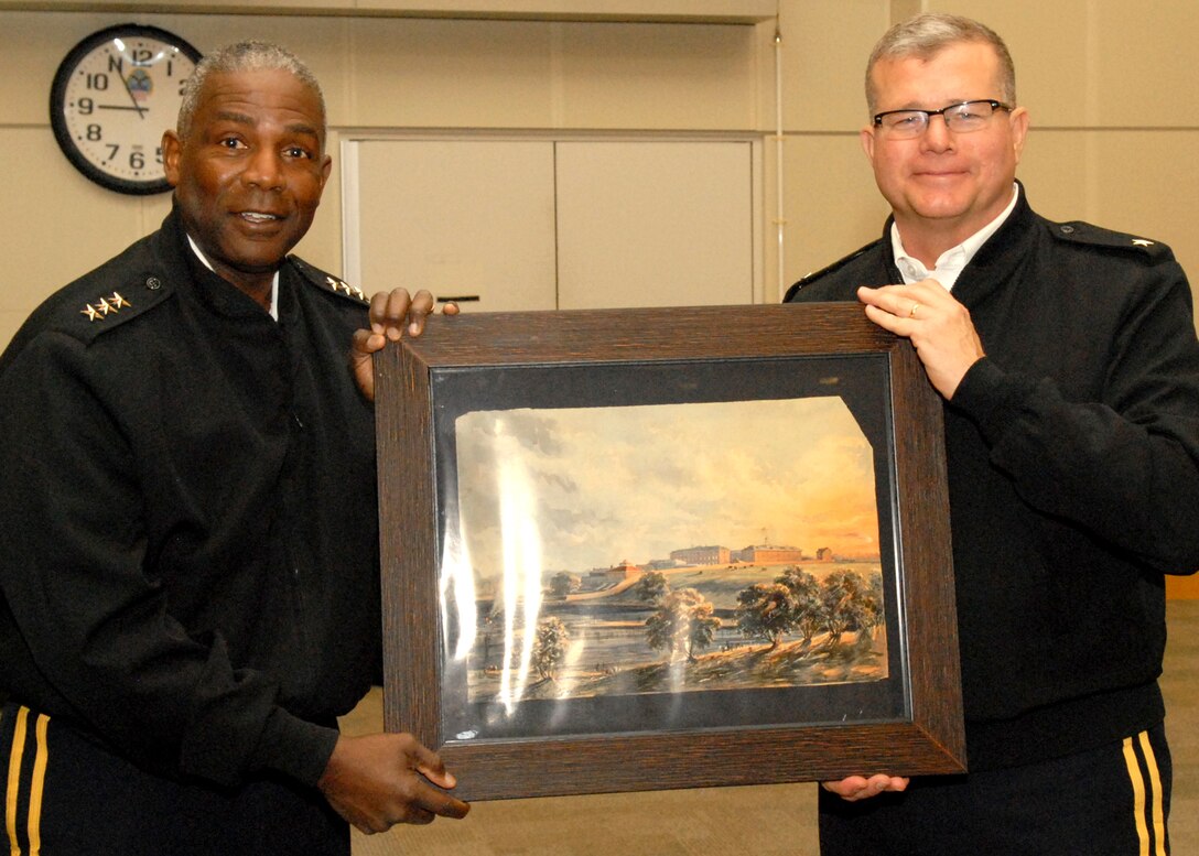 DLA Troop Support Commander Army Brig. Gen. Mark Simerly presents the DLA Director Army Lt. Gen. Darrell Williams with a depiction of the Schuylkill Arsenal in Philadelphia on April 27.