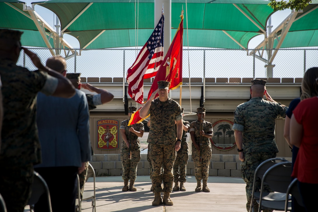 Maj. Gen. William F. Mullen, commanding general, Marine Corps Air Ground Combat Center, renders a salute during the retirement ceremony for Lt. Col. Robert L. Warfield II, director, Marine Corps Community Services, at the flag pole aboard the Combat Center, Twentynine Palms, Calif., April 27, 2018. Warfield retired after 27 years of honorable service to the Marine Corps. (U.S Marine Corps photo by Lance Cpl. Margaret Gale)