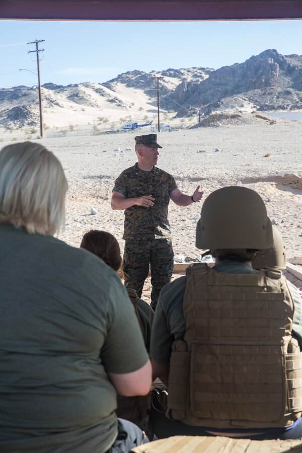 Lt. Col. Eric Clarke, battalion commander, 1st Battalion, 7th Marine Regiment, shares his opening remarks with participants of the unit's Jane Wayne Day at the obstacle course aboard the Marine Corps Air Ground Combat Center, Twentynine Palms, Calif., April 27, 2018. This Jane Wayne Day gave the spouses a glimpse into the day-to-day lives of their active duty spouses through the obstacle course, a live-fire range and different battle simulations. (U.S. Marine Corps photo by Lance Cpl. Dave Flores)