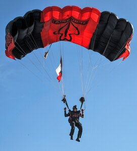 A member of the Black Daggers Parachute Demonstration Team, who are the U.S. Army Special Operations Command Parachute Team, glides in for a landing May 5 at MacArthur Parade Field at Joint Base San Antonio-Fort Sam Houston during the Military Appreciation Weekend celebration May 5-6.