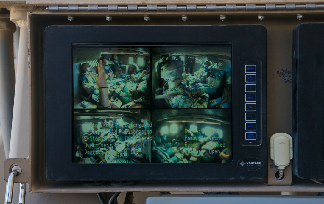 Spouses of Marines in 1st Battalion, 7th Marine Regiment ride in a Mine-Resistant Ambush Protected vehicle rollover simulator at Camp Wilson during the unit's Jane Wayne Day aboard the Marine Corps Air Ground Combat Center, Twentynine Palms, Calif., April 27, 2018. This Jane Wayne Day gave the spouses a glimpse into the day-to-day lives of their active duty spouses through the obstacle course, a live-fire range and different battle simulations. (U.S. Marine Corps photo by Lance Cpl. Dave Flores)