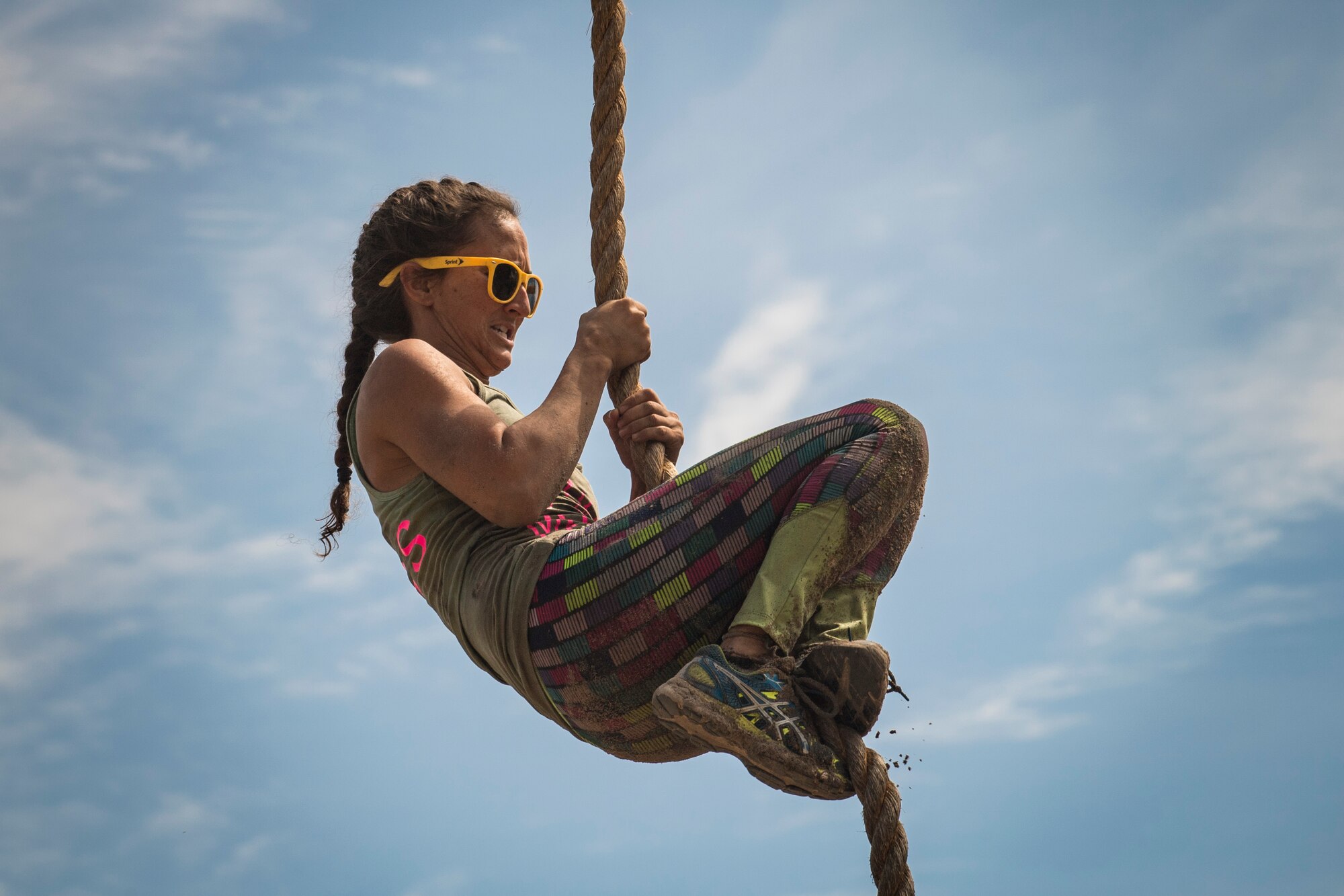 A Moody Mud Run participant slides down a rope obstacle, May 5, 2018, in Ray City, Ga.  Participants trekked 4.6 miles through the mud, water and 29 obstacles that made up the course. This is the fifth year Moody has hosted the event and more than 800 patrons participated. (U.S. Air Force photo by Senior Airman Janiqua P. Robinson)