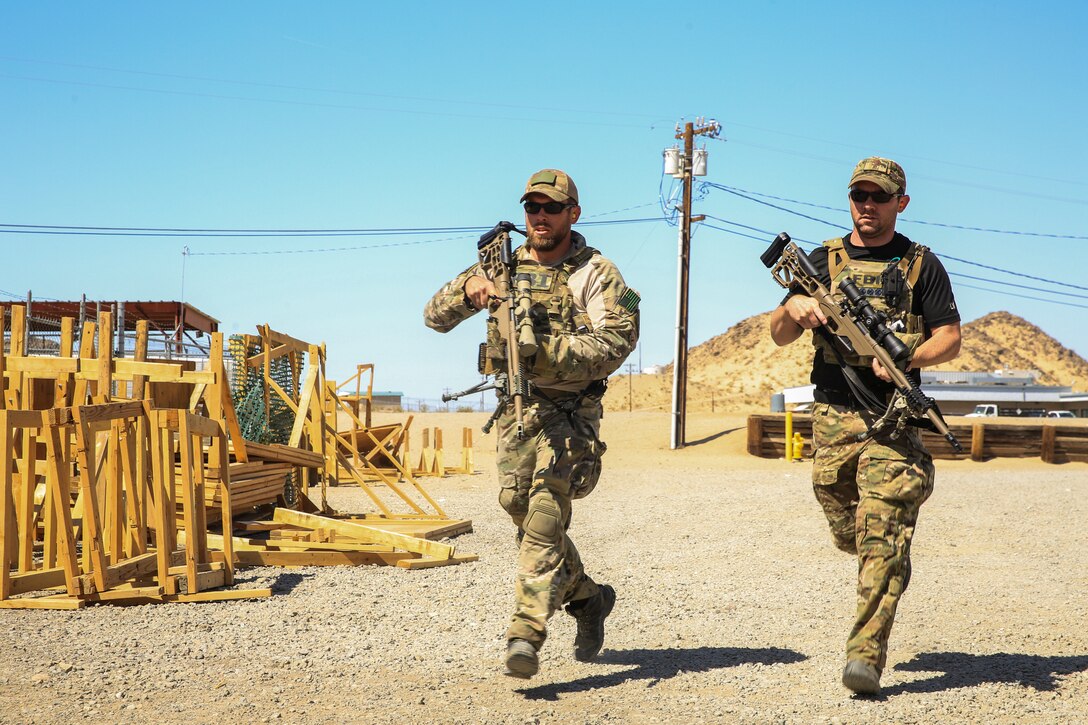gents from the Federal Bureau of Investigation conduct a speed and target locating drill during a sniper training course aboard the Marine Corps Air Ground Combat Center, Twentynine Palms, Calif., April 25, 2018. The sniper course was held from April 24 to April 27, 2018 to advance participants’ skills in marksmanship techniques for combat scenarios.  (U.S. Marine Corps photo by Lance Cpl. Isaac Cantrell)
