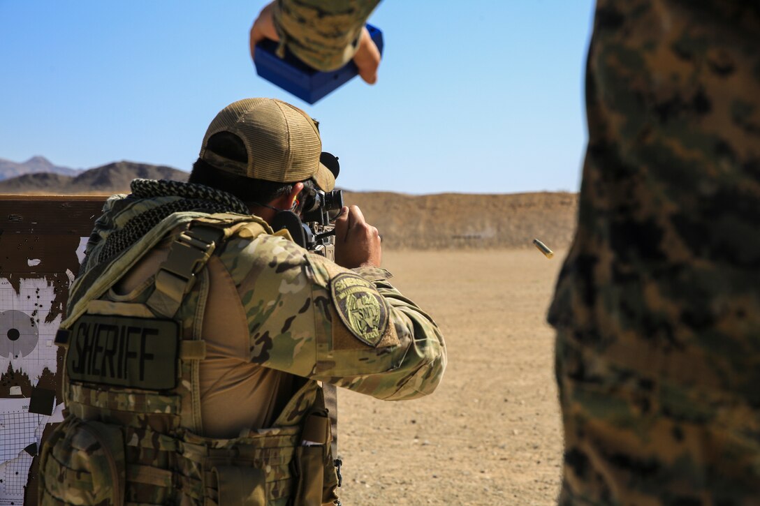 A sheriff from Williamson County sends rounds down range during a sniper training course hosted by the Marksmanship Training Unit aboard the Marine Corps Air Ground Combat Center, Twentynine Palms, Calif., April 25, 2018. The sniper course was held from April 24 to April 27, 2018 to advance participants’ skills in marksmanship techniques for combat scenarios. (U.S. Marine Corps photo by Lance Cpl. Isaac Cantrell)