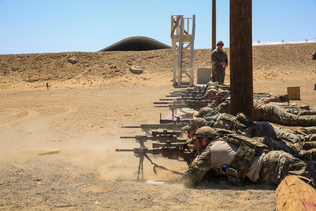 Shooters send rounds down range during a sniper training course hosted by the Marksmanship Training Unit aboard the Marine Corps Air Ground Combat Center, Twentynine Palms, Calif., April 25, 2018. The sniper course was held to advance participants’ skills in marksmanship techniques for combat scenarios. (U.S. Marine Corps photo by Lance Cpl. Trevor Terry)