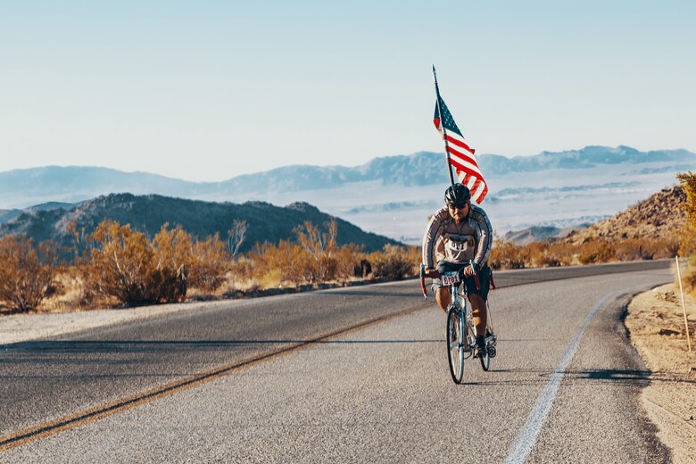 A participant of the 4th Annual Park-2-Park Bike Ride pedals the 52-mile full course through Joshua Tree National Park, Calif., April 28, 2018. The purpose of Park-2-Park is to bring families and friends of Twentynine Palms together in celebration of Earth Day.(U.S. Marine Corps photo by Lance Cpl. Rachel K. Porter)
