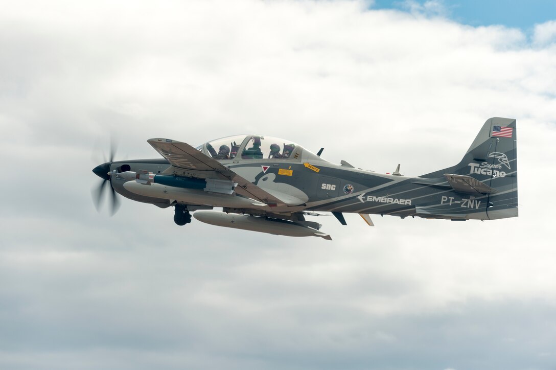 An Embraer EMB 314 Super Tucano A-29 experimental aircraft flies over White Sands Missile Range, N.M., August 1, 2017. The A-29 is participating in the U.S. Air Force Light Attack Experiment (OA-X), a series of trials to determine the feasibility of using light aircraft in attack roles. (U.S. Air Force photo by Ethan D. Wagner)