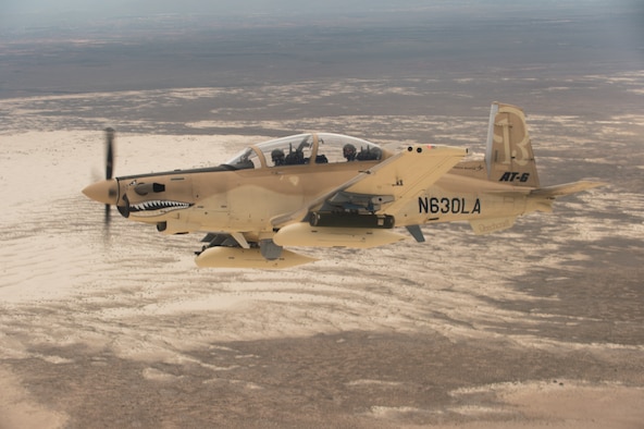 A Beechcraft AT-6 experimental aircraft flies over White Sands Missile Range, N.M. July 31, 2017. The AT-6 is participating in the U.S. Air Force Light Attack Experiment (OA-X), a series of trials to determine the feasibility of using light aircraft in attack roles. (U.S. Air Force photo by Ethan D. Wagner)