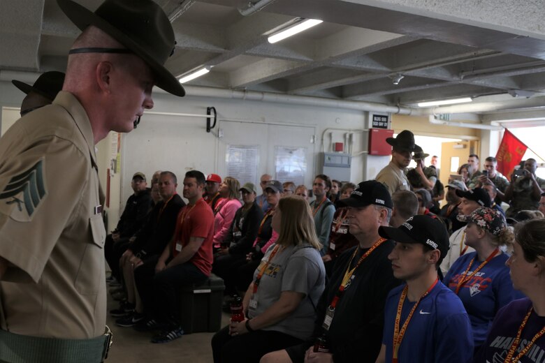 SAN DIEGO, Calif. – Educators experience a mock pick up day, May 2, with drill instructors at Marine Corps Recruit Depot San Diego, Calif., during the Marine Corps Educators Workshop. Pick up day is when recruits meet their drill instructors they will have until graduation. (U.S. Marine Corps photo by Cpl. Calvin H. Hilt)