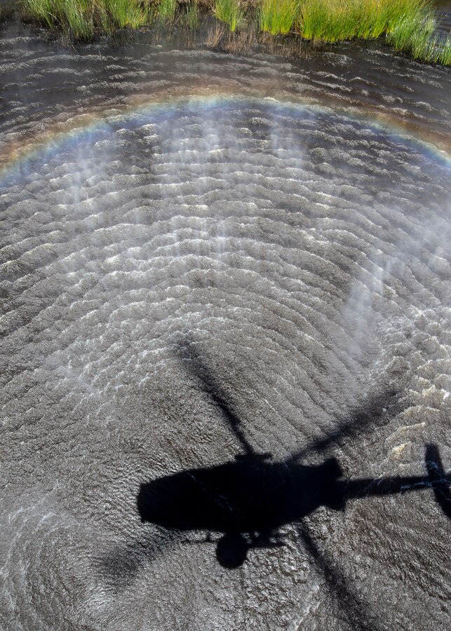 A UH-1Y Venom with Marine Light Attack Helicopter Squadron (HMLA) 267, Marine Aircraft Group 39, 3rd Marine Aircraft Wing, hovers over a lake during the Corey Iverson Wildland Firefighting Exercise at Marine Corps Base Camp Pendleton, Calif., May 3. The exercise is an annual training event designed to increase emergency preparedness and cohesion between civilian and military firefighting agencies during California’s wildfire season. (U.S. Marine Corps photo by Lance Cpl. Clare J. McIntire/Released)