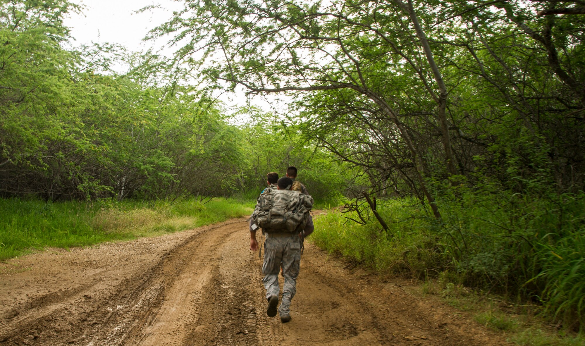 Participants compete against one another during the Inaugural Diamond Mudder, Joint Base Pearl Harbor-Hickam, Hawaii, May 4, 2018.  The Diamond Mudder was a seven-mile team race, consisting of eight obstacles ranging from buddy drags to marksmanship. (U.S. Air Force photo by Tech. Sgt. Heather Redman)