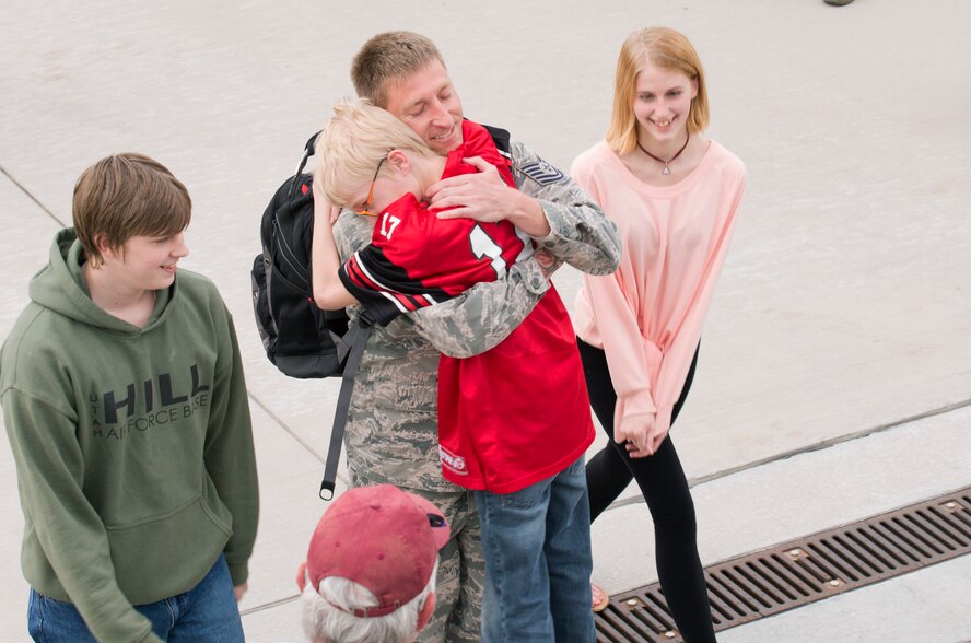 Upon returning home from a six-month deployment, Tech. Sgt. Lance Dooley, crew chief in the 419th Aircraft Maintenance Squadron, greets his children