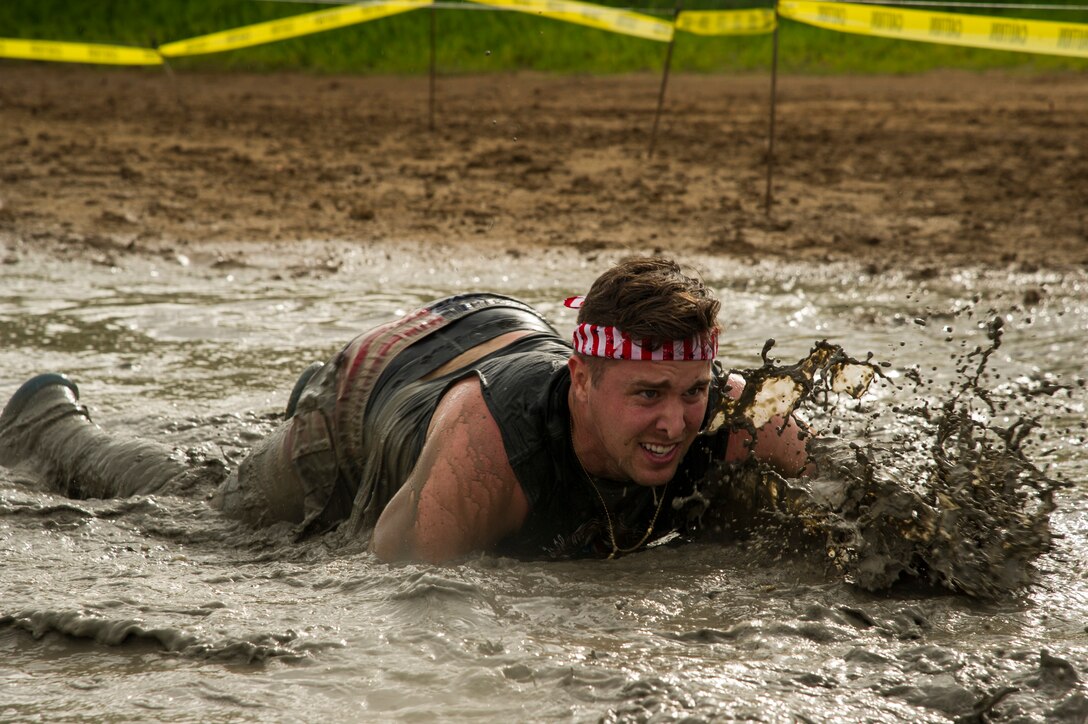 Participants compete against one another during the Inaugural Diamond Mudder, Joint Base Pearl Harbor-Hickam, Hawaii, May 4, 2018.  The Diamond Mudder was a seven-mile team race, consisting of eight obstacles ranging from buddy drags to marksmanship. (U.S. Air Force photo by Tech. Sgt. Heather Redman)