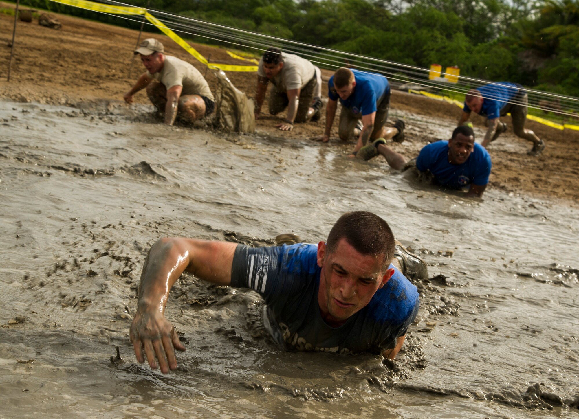 Participants compete against one another during the Inaugural Diamond Mudder, Joint Base Pearl Harbor-Hickam, Hawaii, May 4, 2018.  The Diamond Mudder was a seven-mile team race, consisting of eight obstacles ranging from buddy drags to marksmanship. (U.S. Air Force photo by Tech. Sgt. Heather Redman)