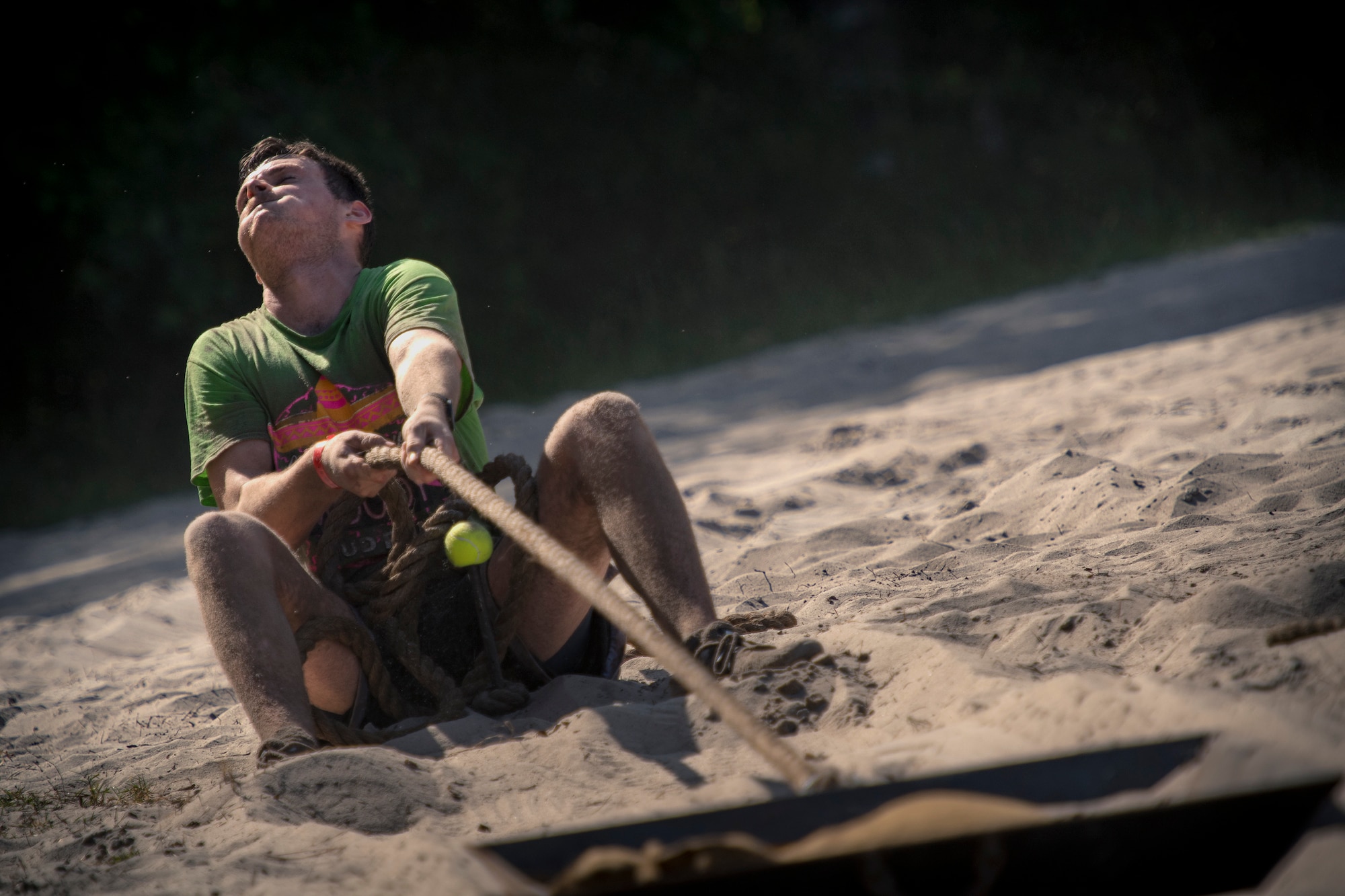 A Moody Mud Run participant pulls a weighted sled, May 5, 2018, in Ray City, Ga. Competitors trekked 4.6 miles through the mud, water and 29 obstacles that made up the course. This is the fifth year Moody has hosted the event and more than 800 patrons participated. (U.S. Air Force photo by Staff Sgt. Ryan Callaghan)