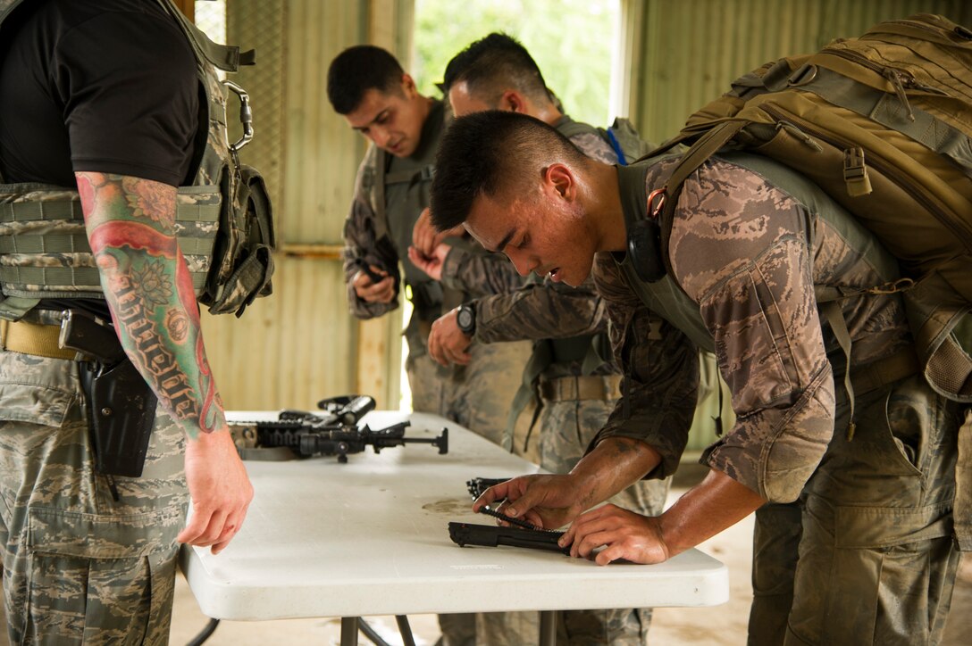 Participants compete against one another during the Inaugural Diamond Mudder, Joint Base Pearl Harbor-Hickam, Hawaii, May 4, 2018.  The Diamond Mudder was a seven-mile team race, consisting of eight obstacles ranging from buddy drags to marksmanship. (U.S. Air Force photo by Tech. Sgt. Heather Redman)