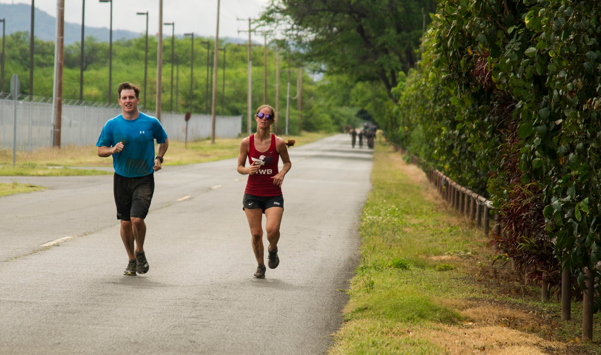 Participants compete against one another during the Inaugural Diamond Mudder, Joint Base Pearl Harbor-Hickam, Hawaii, May 4, 2018.  The Diamond Mudder was a seven-mile team race, consisting of eight obstacles ranging from buddy drags to marksmanship. (U.S. Air Force photo by Tech. Sgt. Heather Redman)