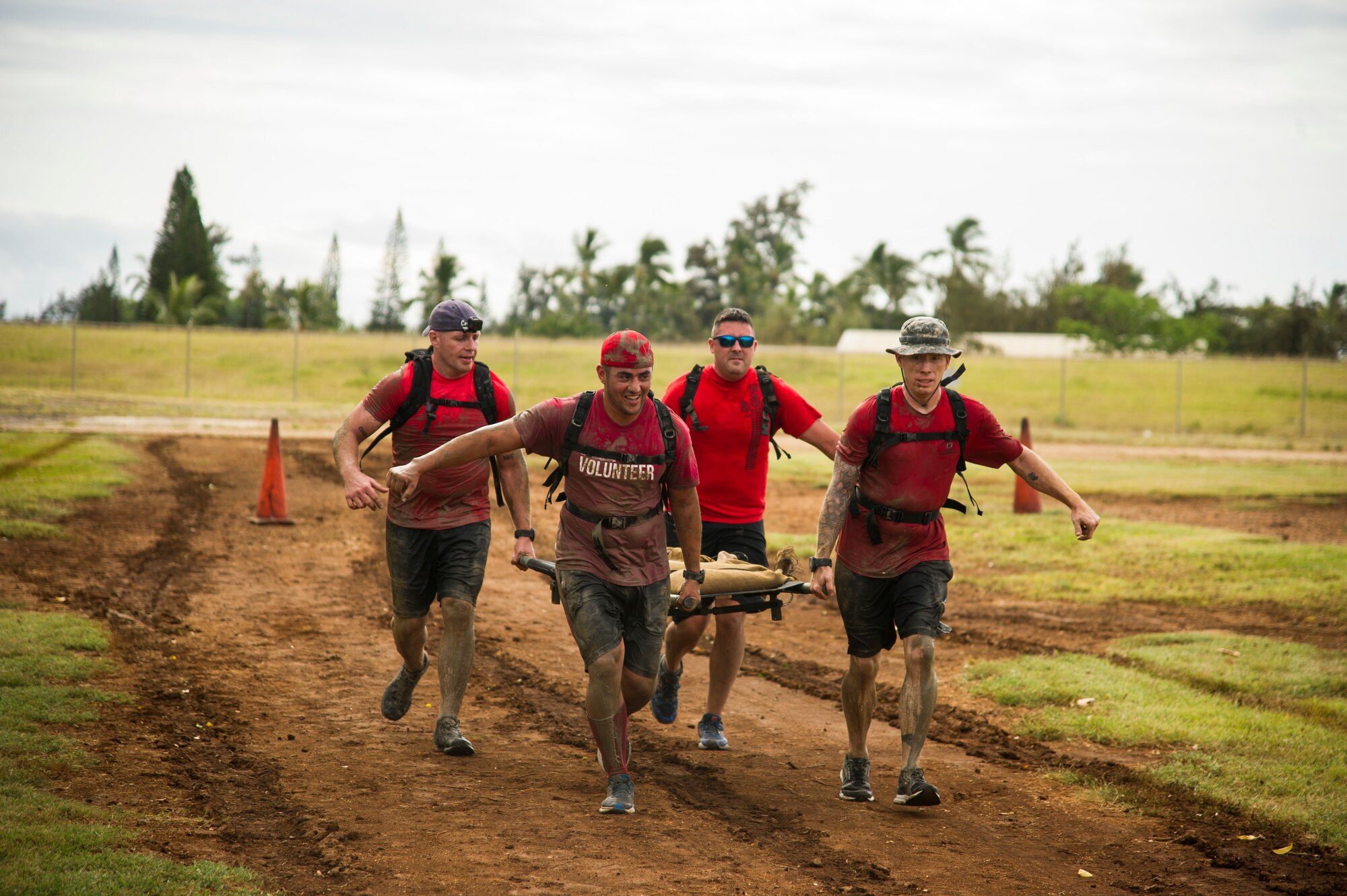Participants compete against one another during the Inaugural Diamond Mudder, Joint Base Pearl Harbor-Hickam, Hawaii, May 4, 2018.  The Diamond Mudder was a seven-mile team race, consisting of eight obstacles ranging from buddy drags to marksmanship. (U.S. Air Force photo by Tech. Sgt. Heather Redman)