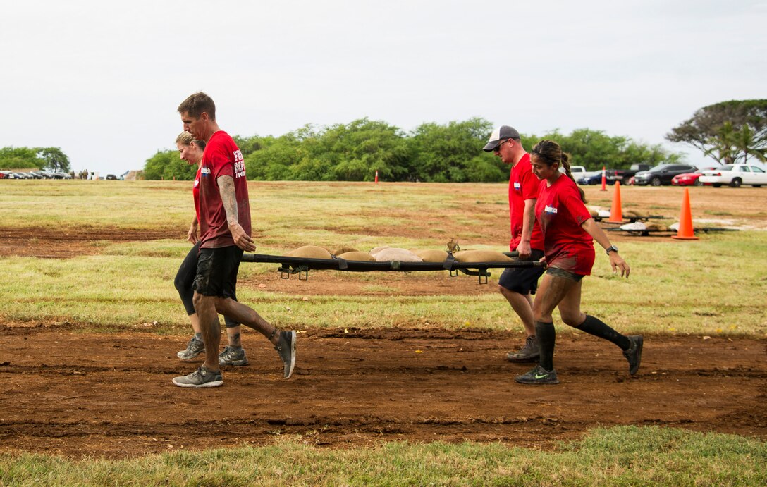 Participants compete against one another during the Inaugural Diamond Mudder, Joint Base Pearl Harbor-Hickam, Hawaii, May 4, 2018.  The Diamond Mudder was a seven-mile team race, consisting of eight obstacles ranging from buddy drags to marksmanship. (U.S. Air Force photo by Tech. Sgt. Heather Redman)
