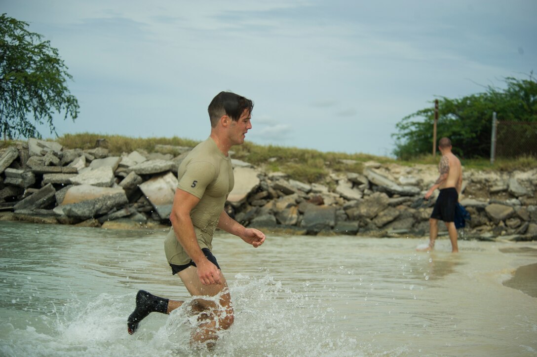 Participants compete against one another during the Inaugural Diamond Mudder, Joint Base Pearl Harbor-Hickam, Hawaii, May 4, 2018.  The Diamond Mudder was a seven-mile team race, consisting of eight obstacles ranging from buddy drags to marksmanship. (U.S. Air Force photo by Tech. Sgt. Heather Redman)