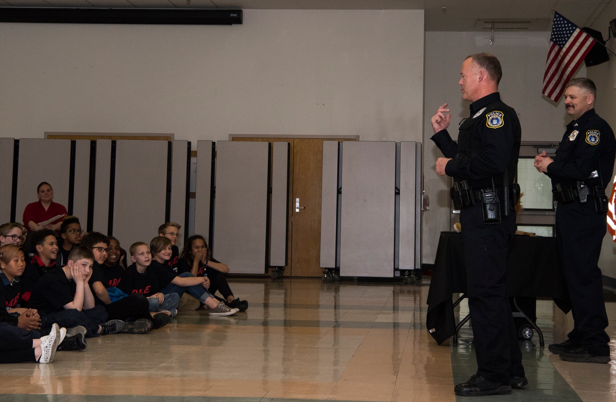 Police officers from the 673d Security Forces Squadron speak with students from the Drug Abuse Resistance Education program at Ursa Major Elementary School at Joint Base Elmendorf-Richardson, Alaska, May 2, 2018. D.A.R.E. is a program designed to provide students with the knowledge and tools they need to resist drugs, alcohol and other high-risk behaviors.