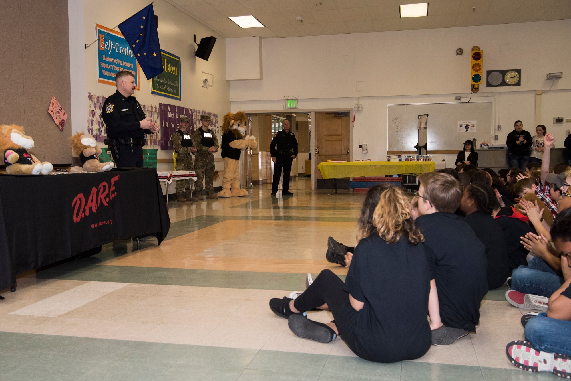 Michael J. Crerend, lead police officer with the 673d Security Forces Squadron and Drug Abuse Resistance Education officer, speaks with students from the D.A.R.E. program at Ursa Major Elementary School at Joint Base Elmendorf-Richardson, Alaska, May 2, 2018. D.A.R.E. is a program designed to provide students with the knowledge and tools they need to resist drugs, alcohol and other high-risk behaviors.