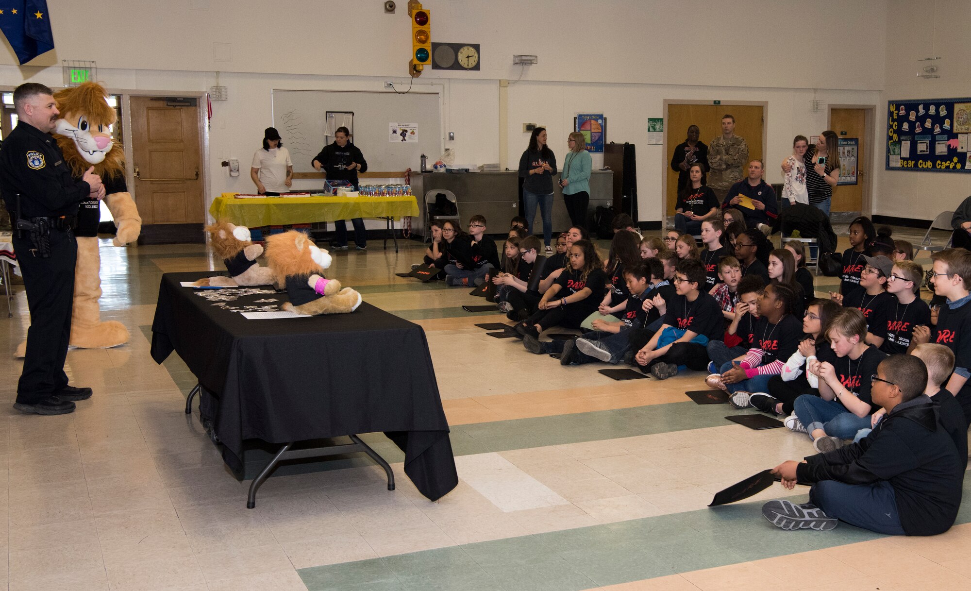 Michael J. Crerend, lead police officer with the 673d Security Forces Squadron and Drug Abuse Resistance Education officer, speaks with students from the D.A.R.E. program at Ursa Major Elementary School at Joint Base Elmendorf-Richardson, Alaska, May 2, 2018. D.A.R.E. is a program designed to provide students with the knowledge and tools they need to resist drugs, alcohol and other high-risk behaviors.