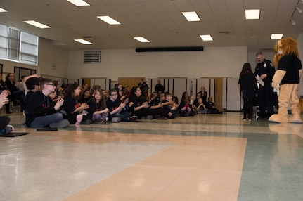 Michael J. Crerend, lead police officer with the 673d Security Forces Squadron and Drug Abuse Resistance Education officer, speaks with one of the students from the D.A.R.E. program at Ursa Major Elementary School at Joint Base Elmendorf-Richardson, Alaska, May 2, 2018. D.A.R.E. is a program designed to provide students with the knowledge and tools they need to resist drugs, alcohol and other high-risk behaviors.