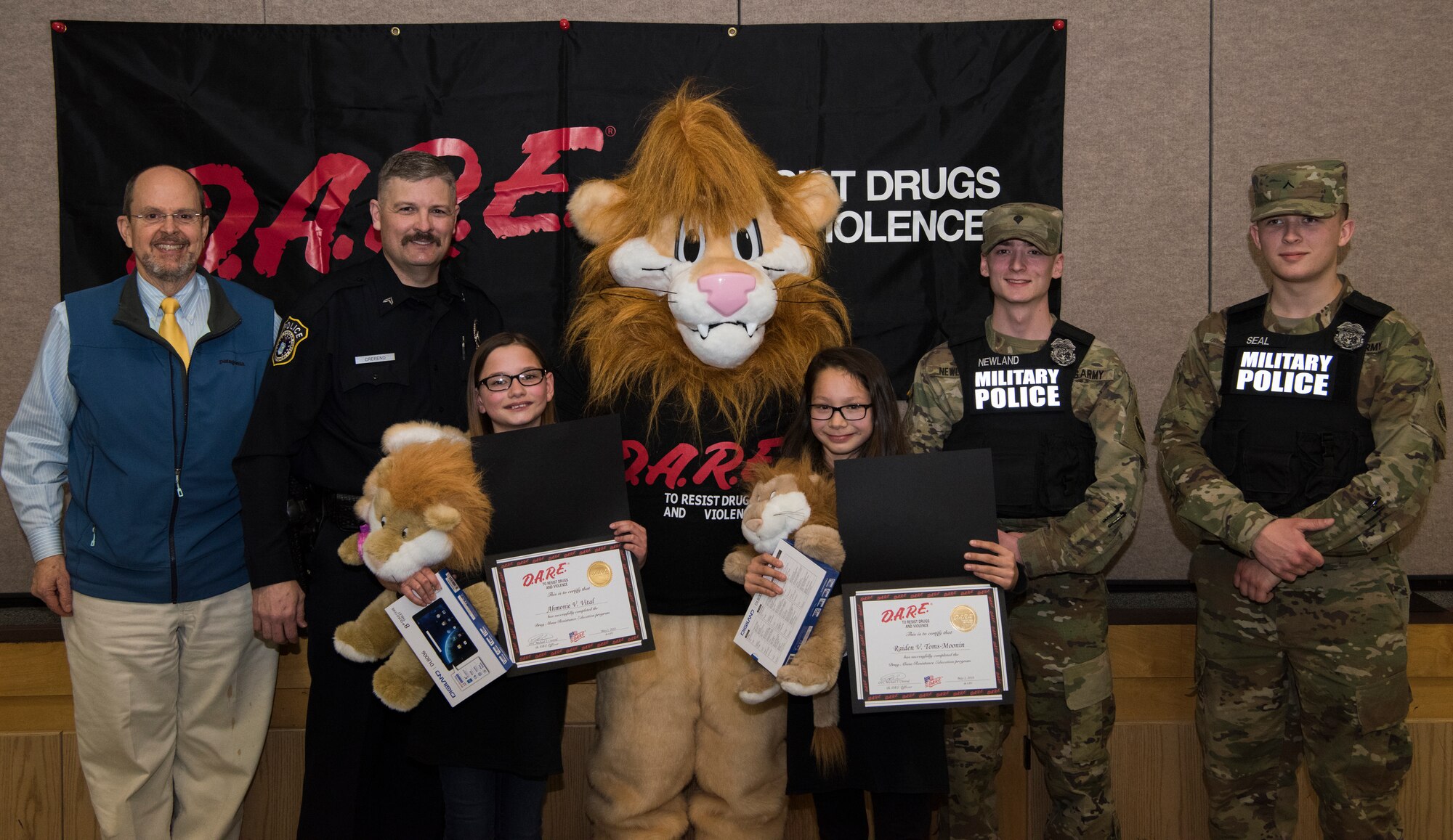 Drug Abuse Resistance Education supporters pose for a photo at Ursa Major Elementary School at Joint Base Elmendorf-Richardson, Alaska, May 2, 2018. D.A.R.E. is a program designed to provide students with the knowledge and tools they need to resist drugs, alcohol and other high-risk behaviors.
