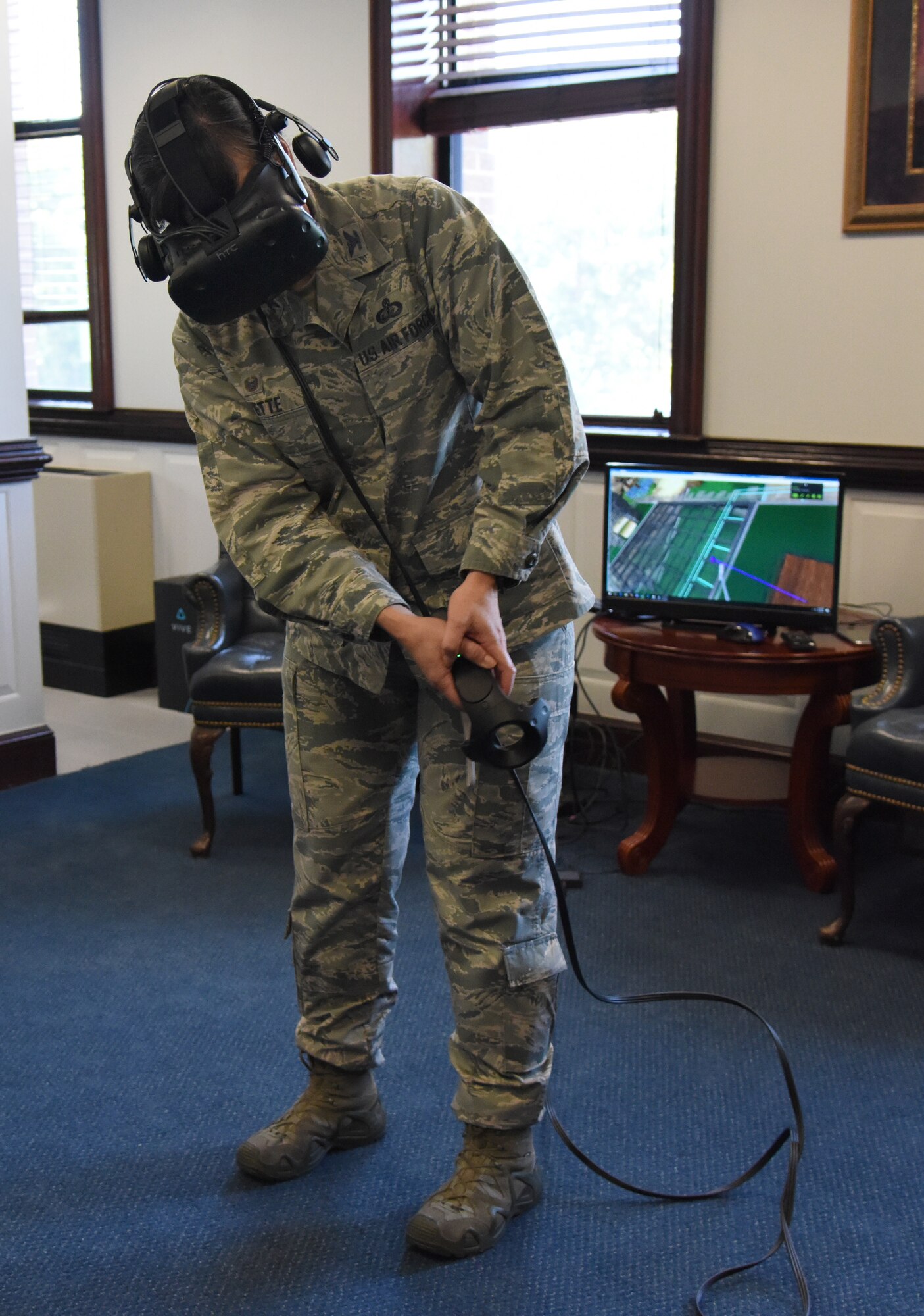 U.S. Air Force Col. Debra Lovette, 81st Training Wing commander, participates in a virtual reality demonstration in the 81st TRW headquarters building at Keesler Air Force Base, Mississippi, May 4, 2018. The 81st Training Group has implemented augmented and virtual reality into training, such as airfield, weather and air traffic control training. (U.S. Air Force photo by Kemberly Groue)