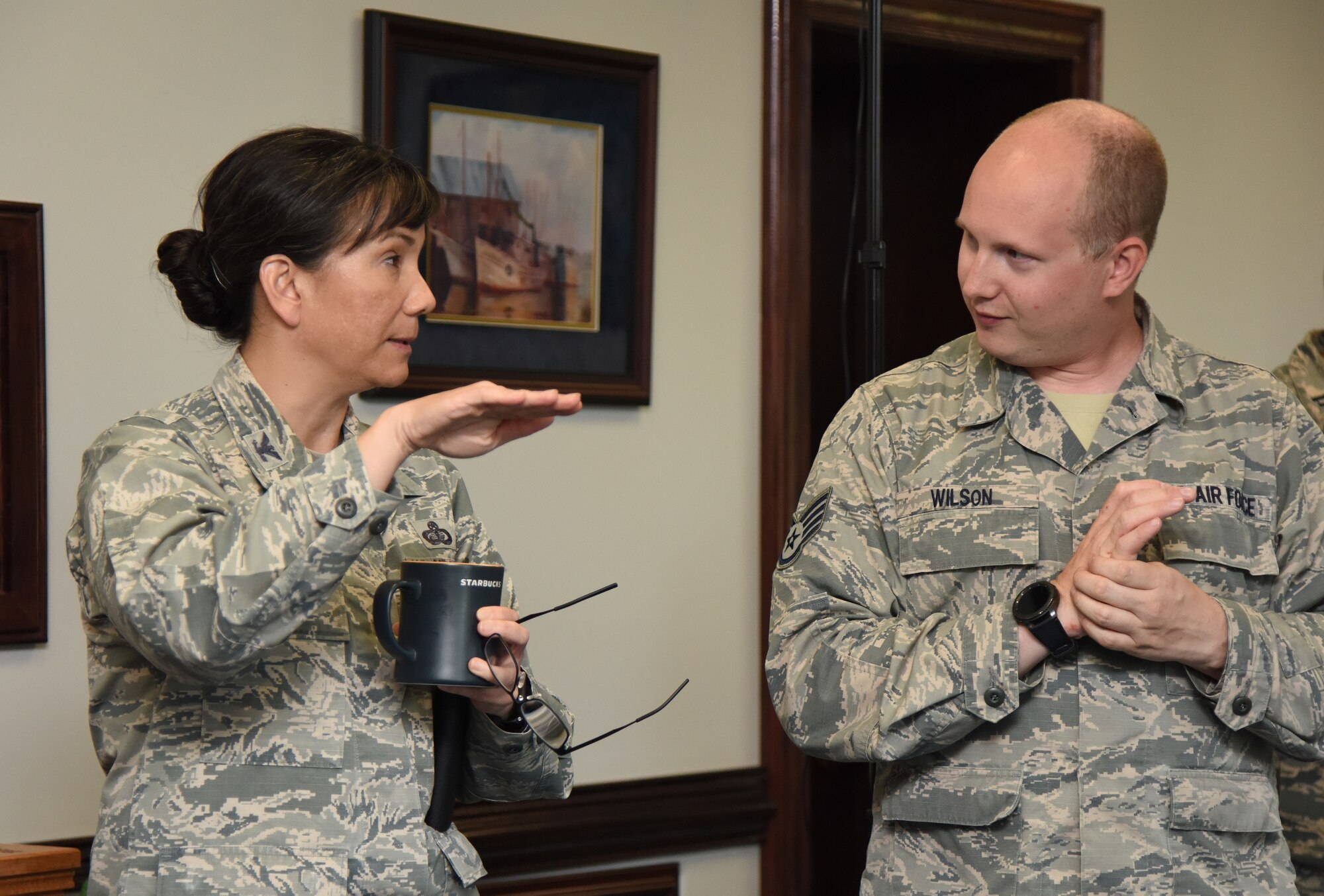 U.S. Air Force Col. Debra Lovette, 81st Training Wing commander, discusses the benefits of using virtual reality for training purposes with Staff Sgt. Chris Wilson, 81st Training Support Squadron instructional developer, in the 81st TRW headquarters building at Keesler Air Force Base, Mississippi, May 4, 2018. The 81st Training Group has implemented augmented and virtual reality into training, such as airfield, weather and air traffic control training. (U.S. Air Force photo by Kemberly Groue)