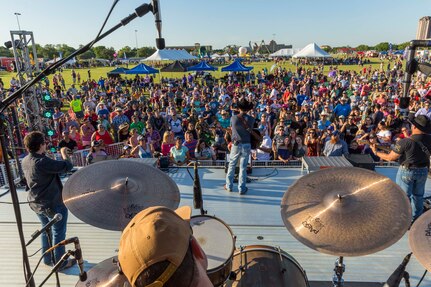 Team Joint Base San Antonio and community members attend an Aaron Watson concert during the annual Military Appreciation Weekend May 6, 2017 at Joint Base San Antonio-Fort Sam Houston, Texas. U.S. U.S. Army North and JBSA hosted the two-day event, which featured music, family activities, and various military demonstrations. This year, the appreciation weekend also commemorated the 300th anniversary for the city of San Antonio. (U.S. Air Force photo by Ismael Ortega / Released)