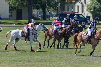 U.S. Army and Navy polo teams compete against one another during the annual Military Appreciation Weekend May 6, 2017 at Joint Base San Antonio-Fort Sam Houston, Texas. U.S. U.S. Army North and JBSA hosted the two-day event, which featured music, family activities, and various military demonstrations. This year, the appreciation weekend also commemorated the 300th anniversary for the city of San Antonio. (U.S. Air Force photo by Ismael Ortega / Released)