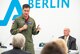 Capt. Andrew “Dojo” Olson, F-35 Heritage Flight Team commander and pilot, speaks to the media during a press conference at the 2018 Berlin Air and Trade Show at the Berlin Schönefeld Airport in Berlin, April 26, 2018. The press conference allowed Olson to share his personal experiences in flying the Air Force’s most advanced fighter jet as well as answer questions from various members of the media