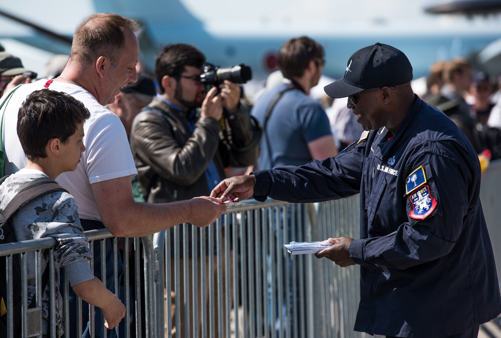 Staff Sgt. Ivan Sumter, F-35 Heritage Flight Team crew chief, interacts with air show guests during the 2018 Berlin Air and Trade show at the Berlin Schönefeld Airport in Berlin, April 28, 2018. The show provides a collaborative opportunity to share and strengthen the U.S. and European strategic partnership that has been forged during the last seven decades and is built on a foundation of shared values, experiences and vision.