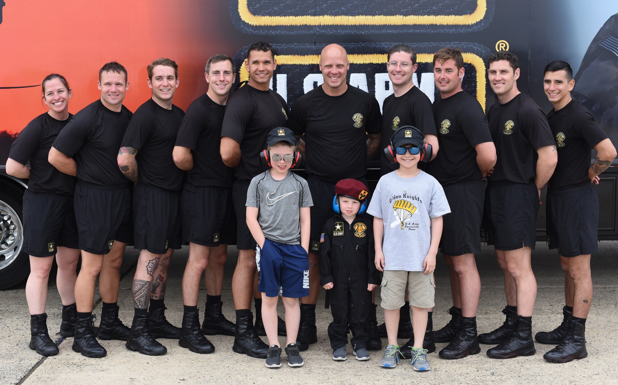 The Gold Demonstration Team, part of the Strategic Army Corps Sport Parachute Team, pose for a photo during the Power in the Pines Open House and Airshow on Joint Base McGuire-Dix-Lakehurst, N.J., May 5, 2018. The Army Golden Knights performed two times during each day of the airshow. The first performance was a mass exit and the second was a full performance. (U.S. Air Force photo by Airman Ariel Owings)