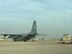 Iraqi Air Force aerial port technicians back up a K-Loader after removing cargo off a C-130 Hercules from the Kentucky Air National Guard, at Al Muthana Air Base, April 5, 2018. The Iraqi aerial port technicians, along with 370th Air Expeditionary Advisory Group air advisor observers, who are part of the Coalition Aviation Advisory and Training Team, worked together to off-load cargo and load three C-130J Super Hercules engines on to U.S. Air Force aircraft, being sent back to the manufacturer for maintenance. (Courtesy Photo)